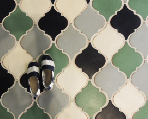 Colorful tile with a pair of shoes